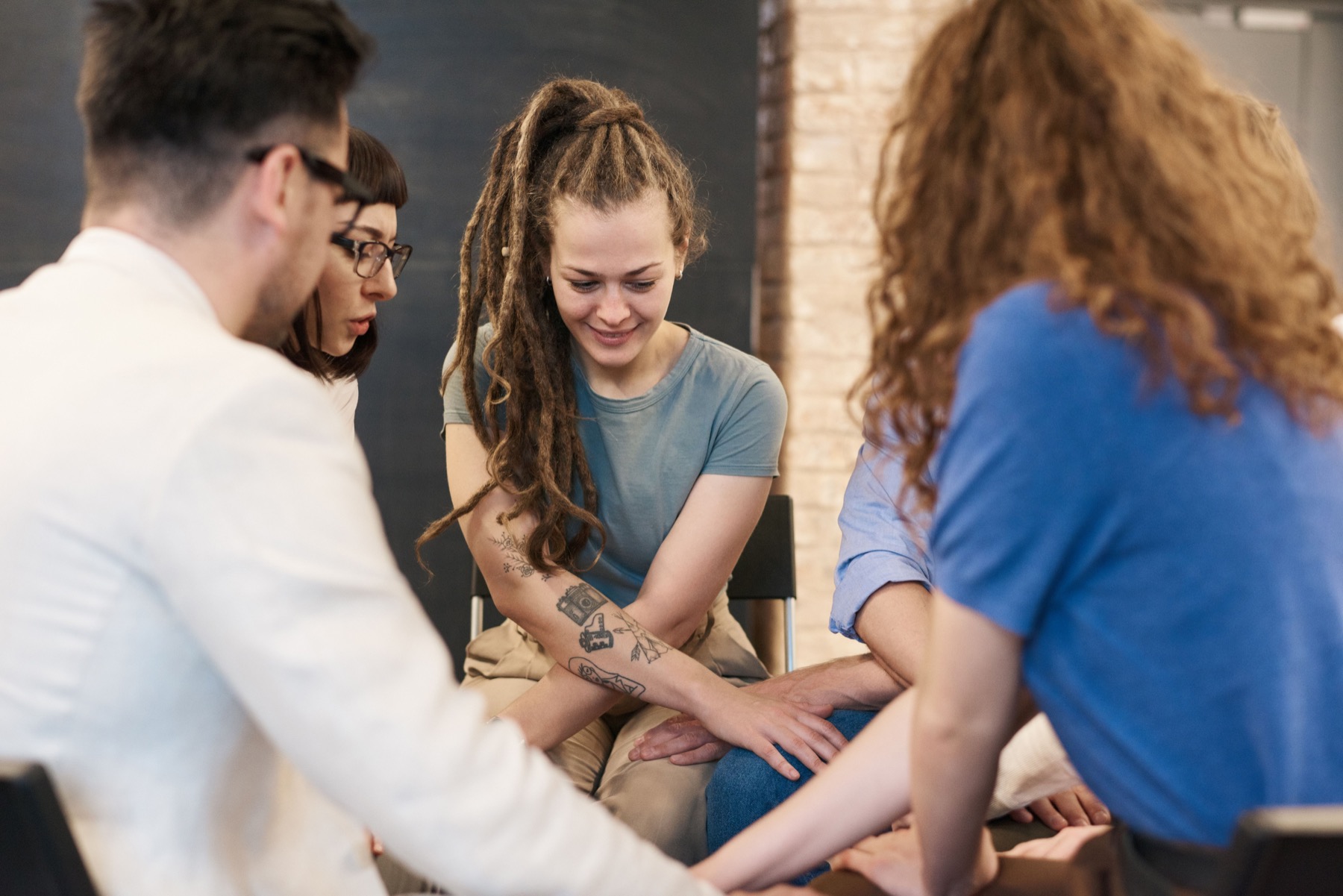 Adults connecting through a shared gesture of support